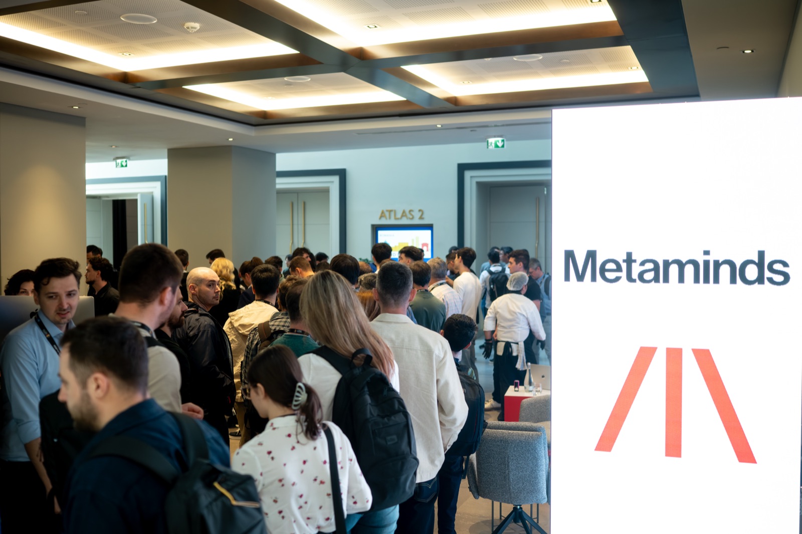 A crowd at the Metaminds space — Cloud Native Days Romania 2026, Bucharest