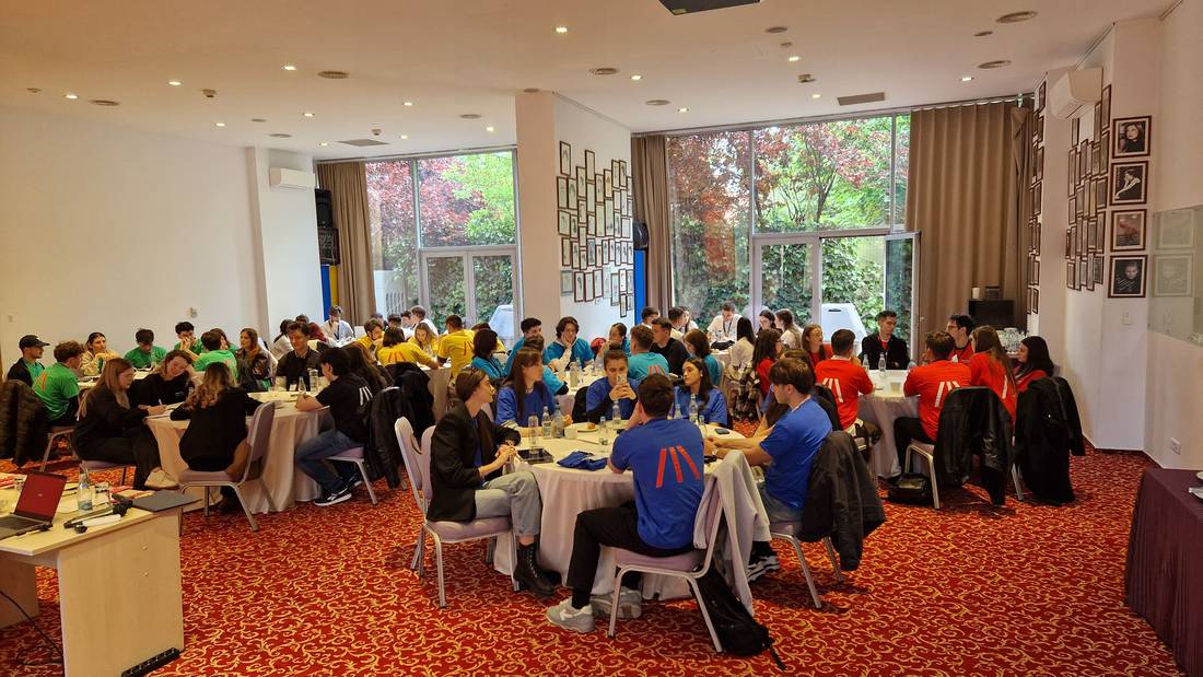 The room set up before a session, with the team T-shirts